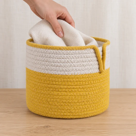 Round Cotton Rope Laundry Basket in Yellow — In hand