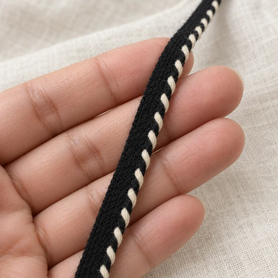 Black and White Piping Trim with Twisted Edge — In hand