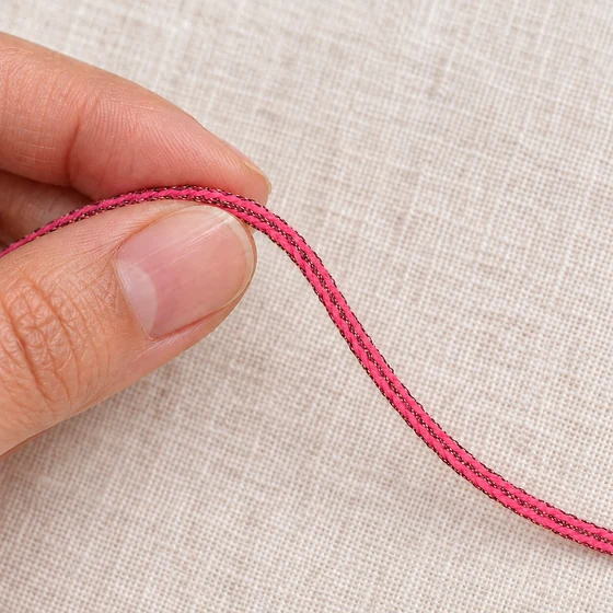 3 mm Bright Pink Choti Braided Trim with Dark Sparkle Thread — In hand