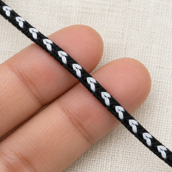 4 mm Black Choti Braided Trim with White Arrow Marks — In hand