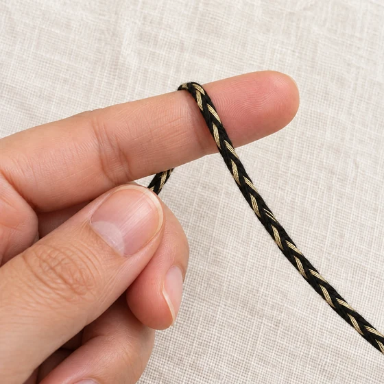 4 mm Black and Gold-Tone Metallic Choti Braided Trim — In hand