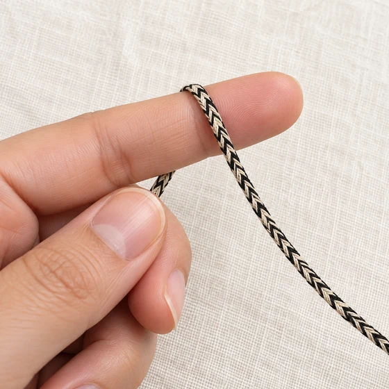 4 mm Black and Cream Chevron Choti Braided Trim — In hand