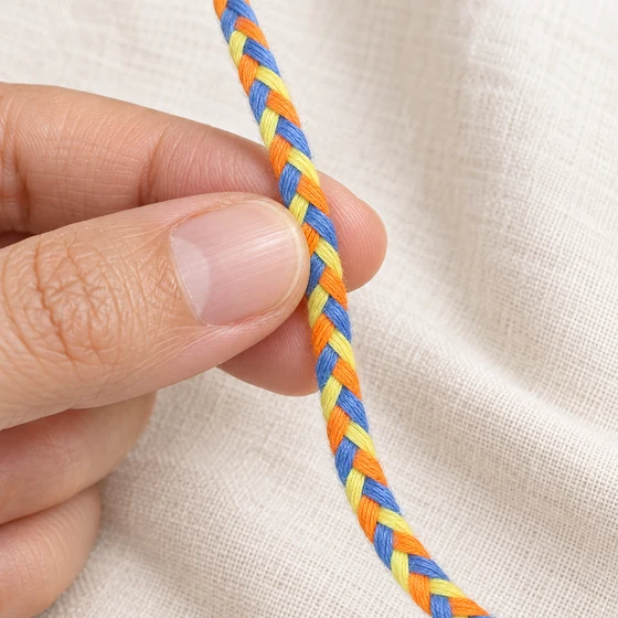 6 mm Blue, Yellow, Orange and Deep Violet Choti Braided Trim — In hand