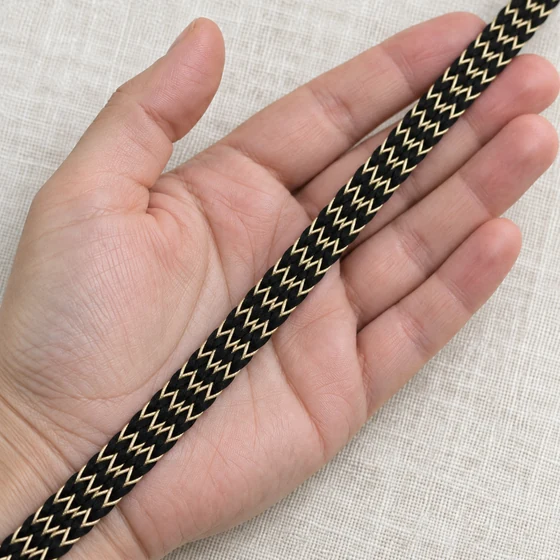 10 mm Black and Gold Fine Chevron Braided Trim — In hand