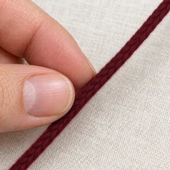 Burgundy Maroon Brushed Choti Braided Trim — In hand