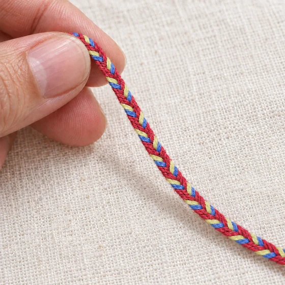 6 mm Bright Red, Blue and Yellow Choti Braided Trim — In hand