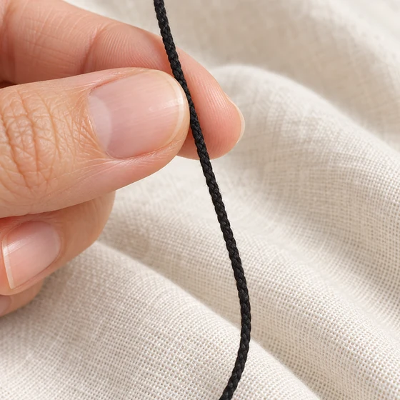 2 mm Black Slim Rounded Choti Braided Trim — In hand