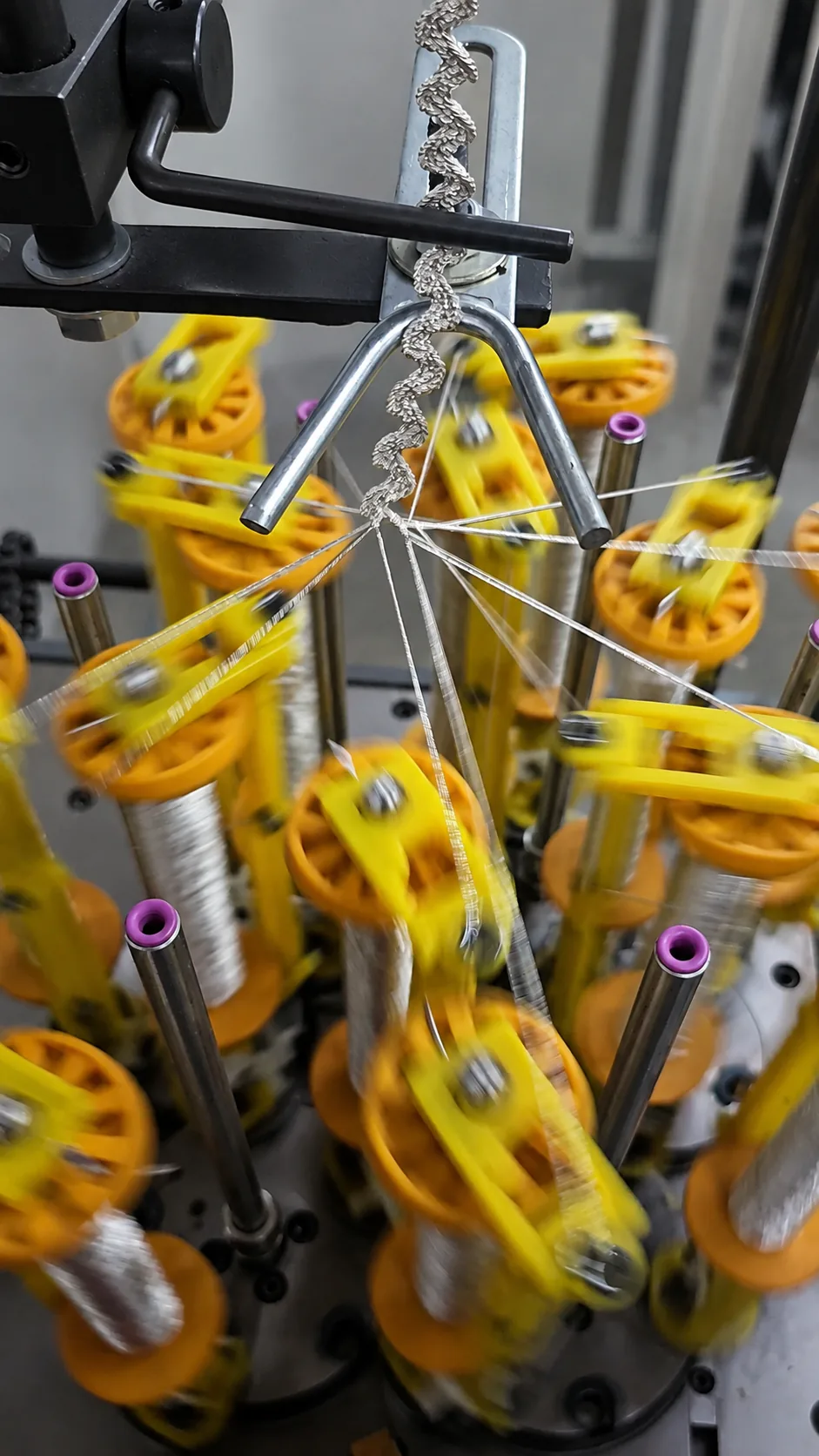 Braiding carrier ring feeding cotton cord on a braiding machine in our Jaipur cordage factory