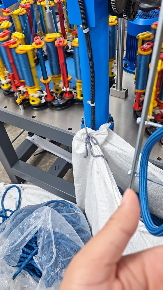 Blue cord on the braiding line in our Jaipur factory