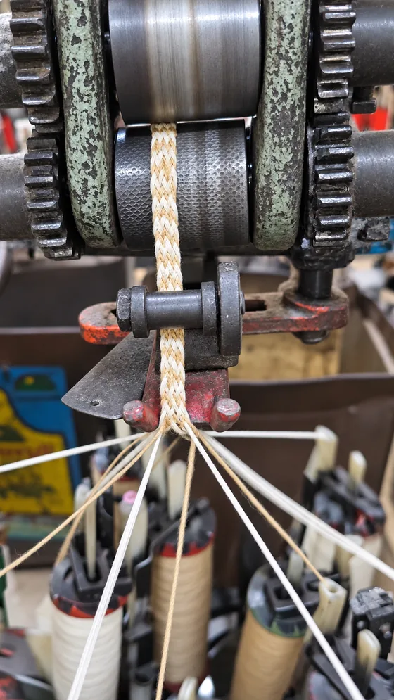 Two-tone braid through the rollers in our Jaipur factory