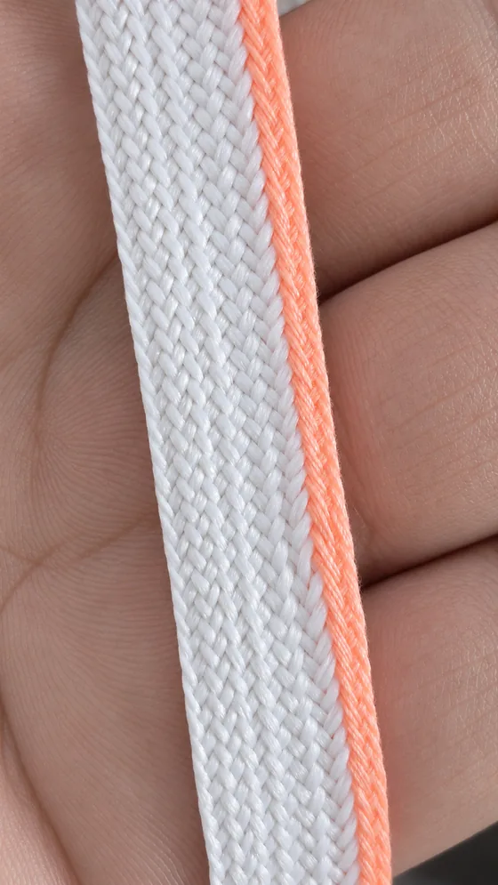 White braid with a peach edge in our Jaipur factory